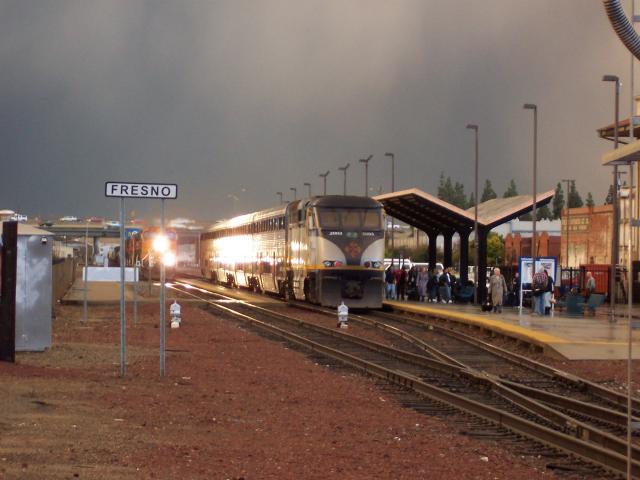 bnsf.jpg - A San Juaquin train going south at Fresno.  A freight train is passing on the left of the train.